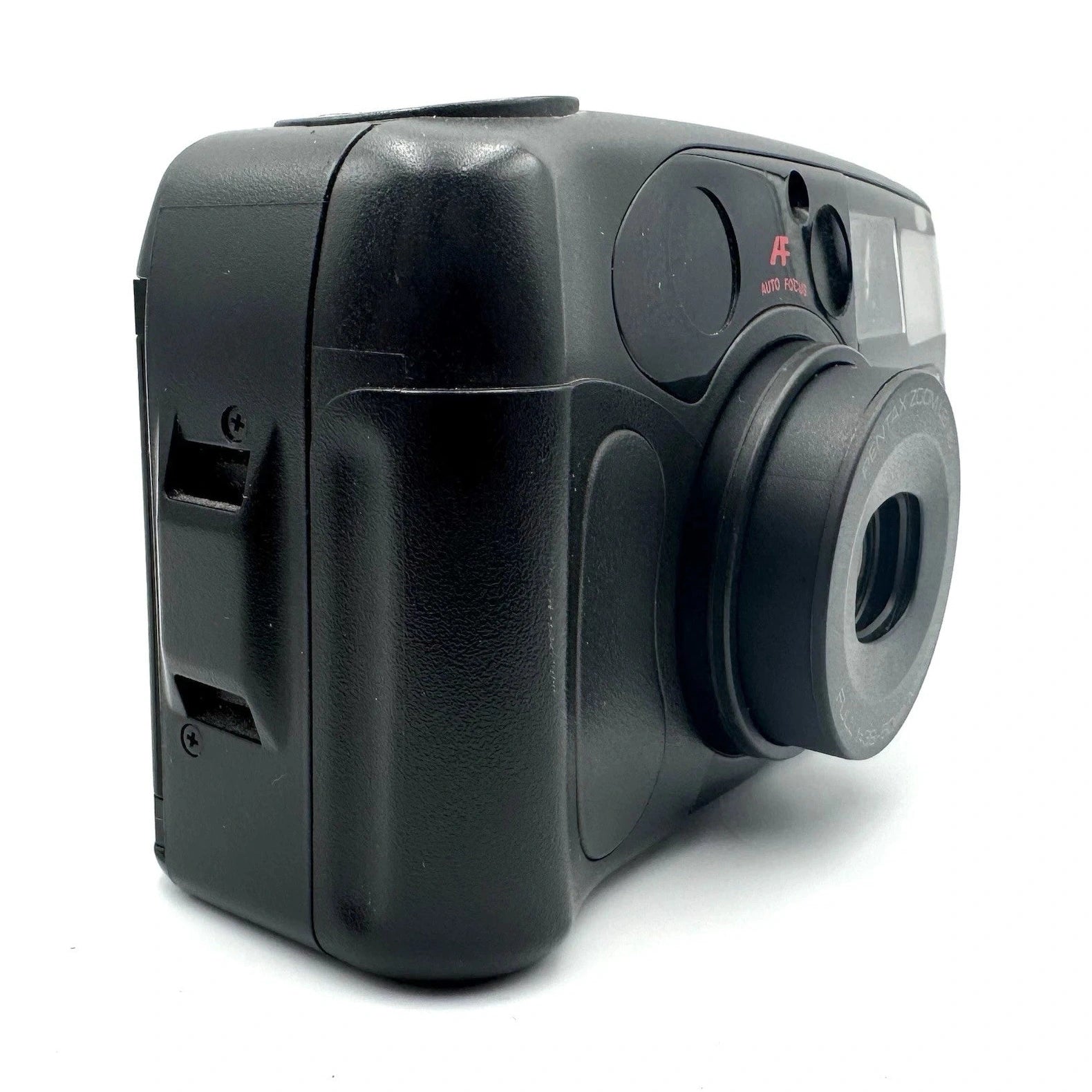 Side-angle rear view of black Pentax IQZoom 60X 35mm film camera highlighting matte plastic body, ergonomic contours, and film slot from ClubCamera.com
