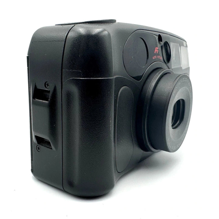 Side-angle rear view of black Pentax IQZoom 60X 35mm film camera highlighting matte plastic body, ergonomic contours, and film slot from ClubCamera.com