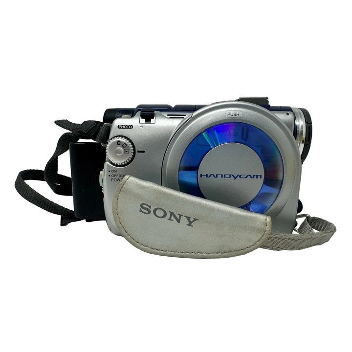 Sony Handycam DVD loading slot open revealing disc front view with protective case ClubCamera.com