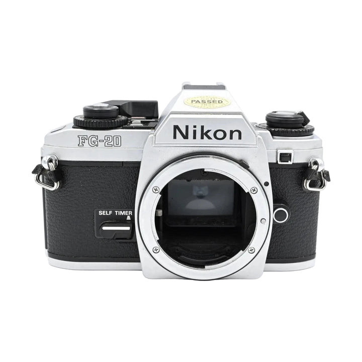 Nikon FG-20 silver and black SLR film camera body with exposed lens mount, textured grip, and PASSED IMOC sticker at ClubCamera.com