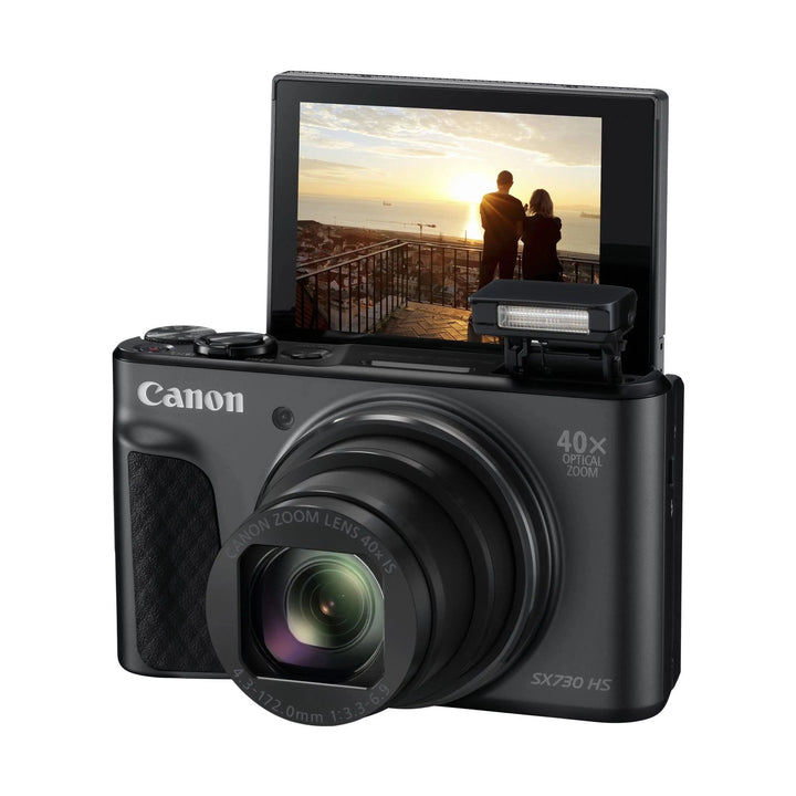 ClubCamera.com black Canon PowerShot SX730 HS with flip-out LCD showing sunset and 40x optical zoom lens