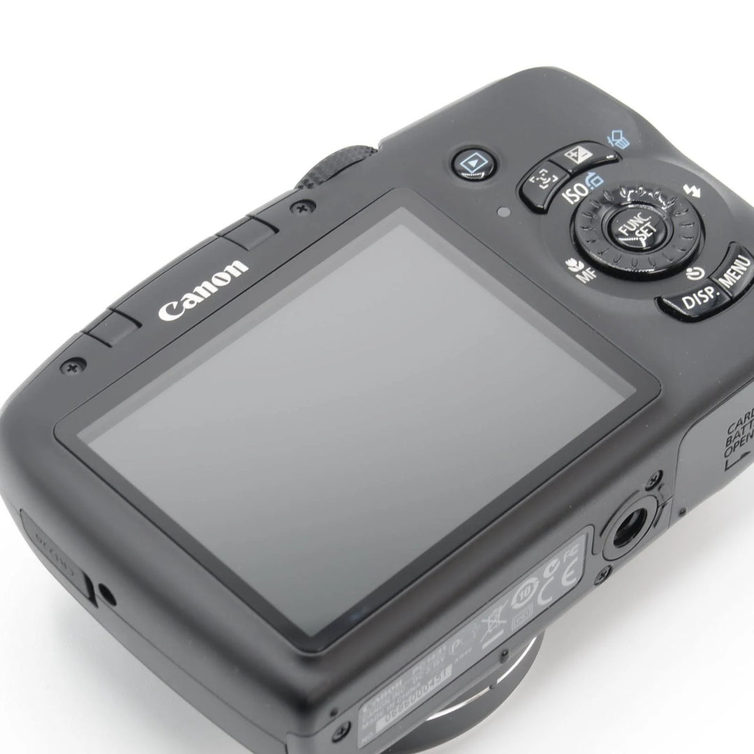 ClubCamera.com Canon PowerShot SX120 IS back panel detail with FUNC SET dial and regulatory label
