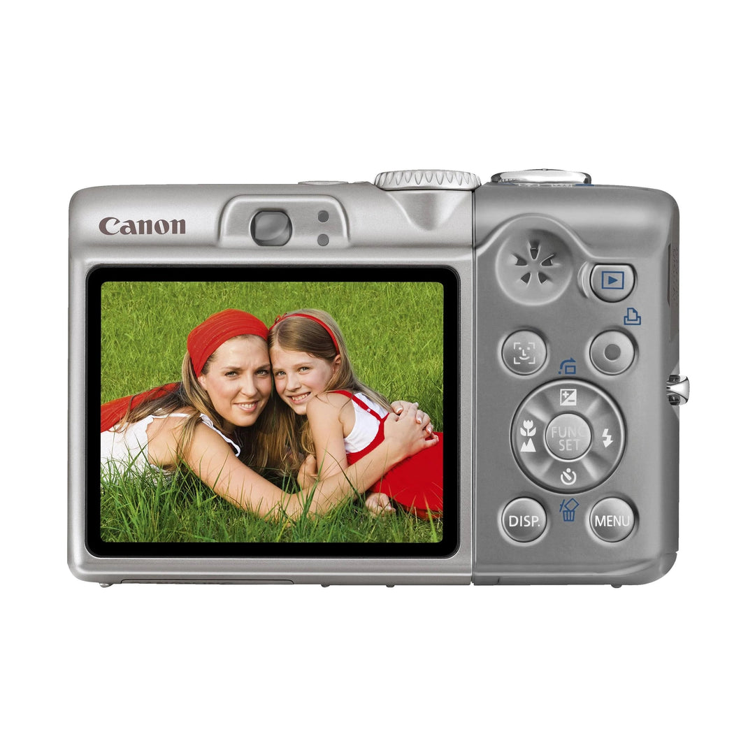 Rear view silver Canon PowerShot A1100 IS digital camera with LCD screen showing outdoor photo, ClubCamera.com