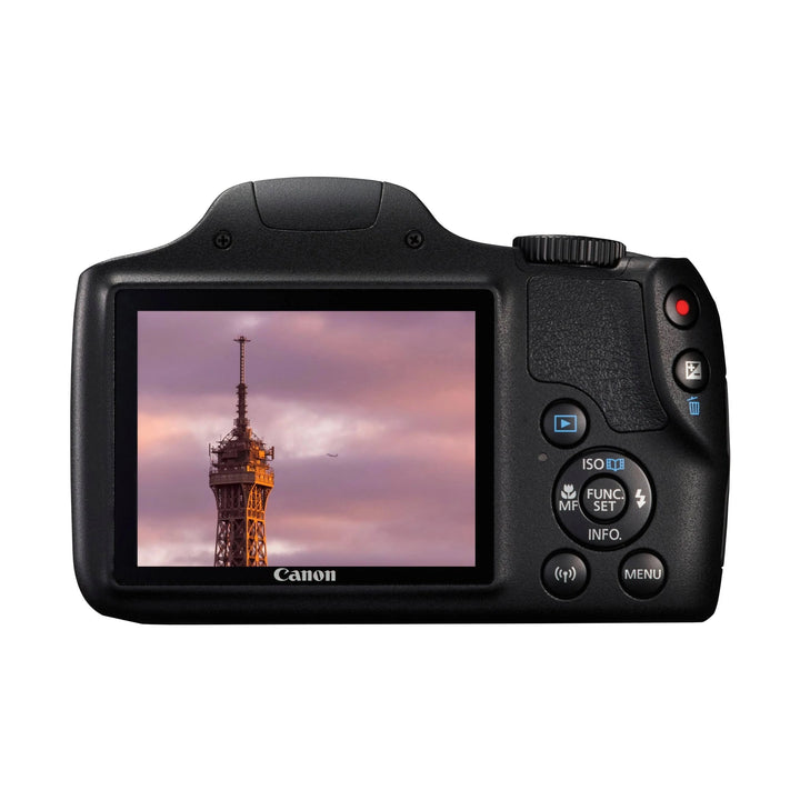 Canon PowerShot SX540 HS black digital camera back view with LCD screen showing sunset tower photo, ClubCamera.com