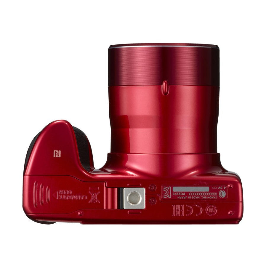 Bottom rear of red Canon SX420 IS showing battery compartment and regulatory labels from ClubCamera.com
