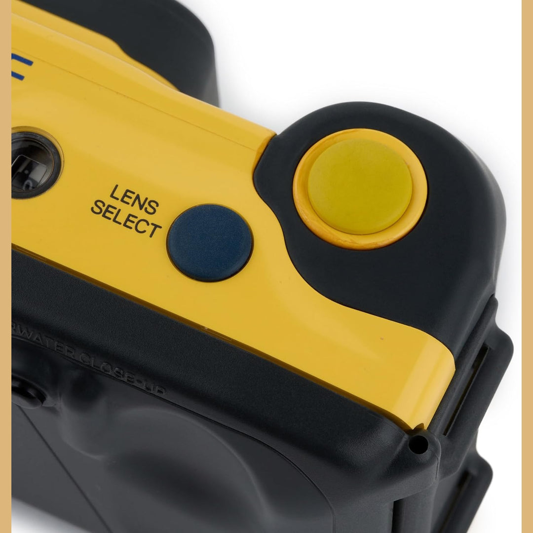 Close-up of yellow Minolta LENS SELECT button and blue selector on underwater camera at ClubCamera.com