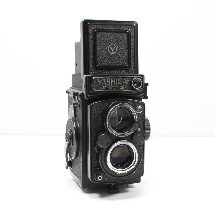 Black Yashica Mat-124G medium format camera with rewind crank and chrome rings sold by ClubCamera.com