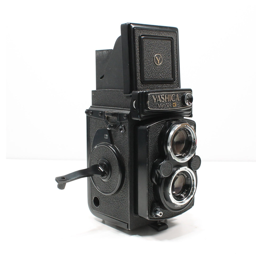 Side view of Yashica Mat-124G twin-lens reflex camera showing advance lever and grip at ClubCamera.com