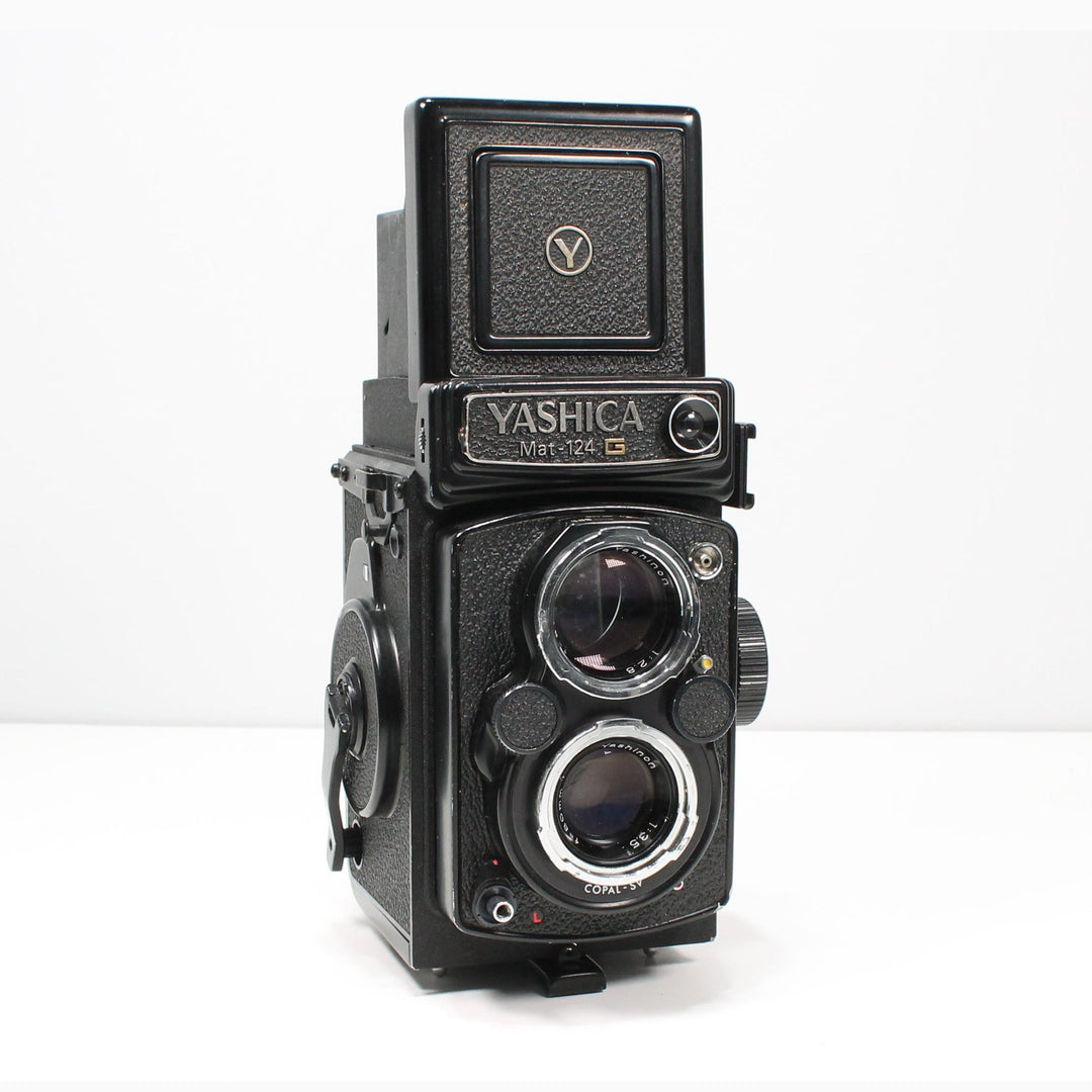 Yashica Mat-124G TLR film camera by ClubCamera.com with chrome dual lenses and textured black body