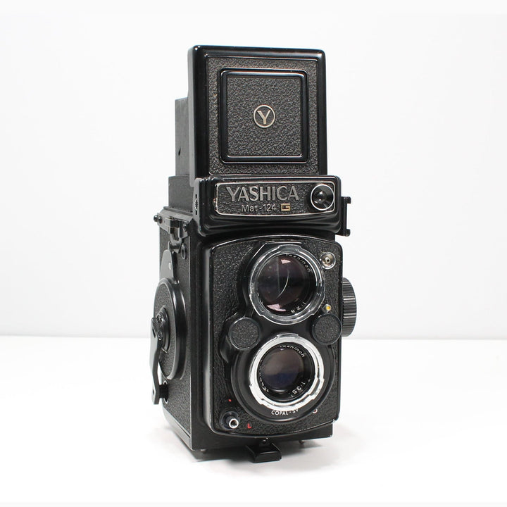 Yashica Mat-124G TLR film camera by ClubCamera.com with chrome dual lenses and textured black body